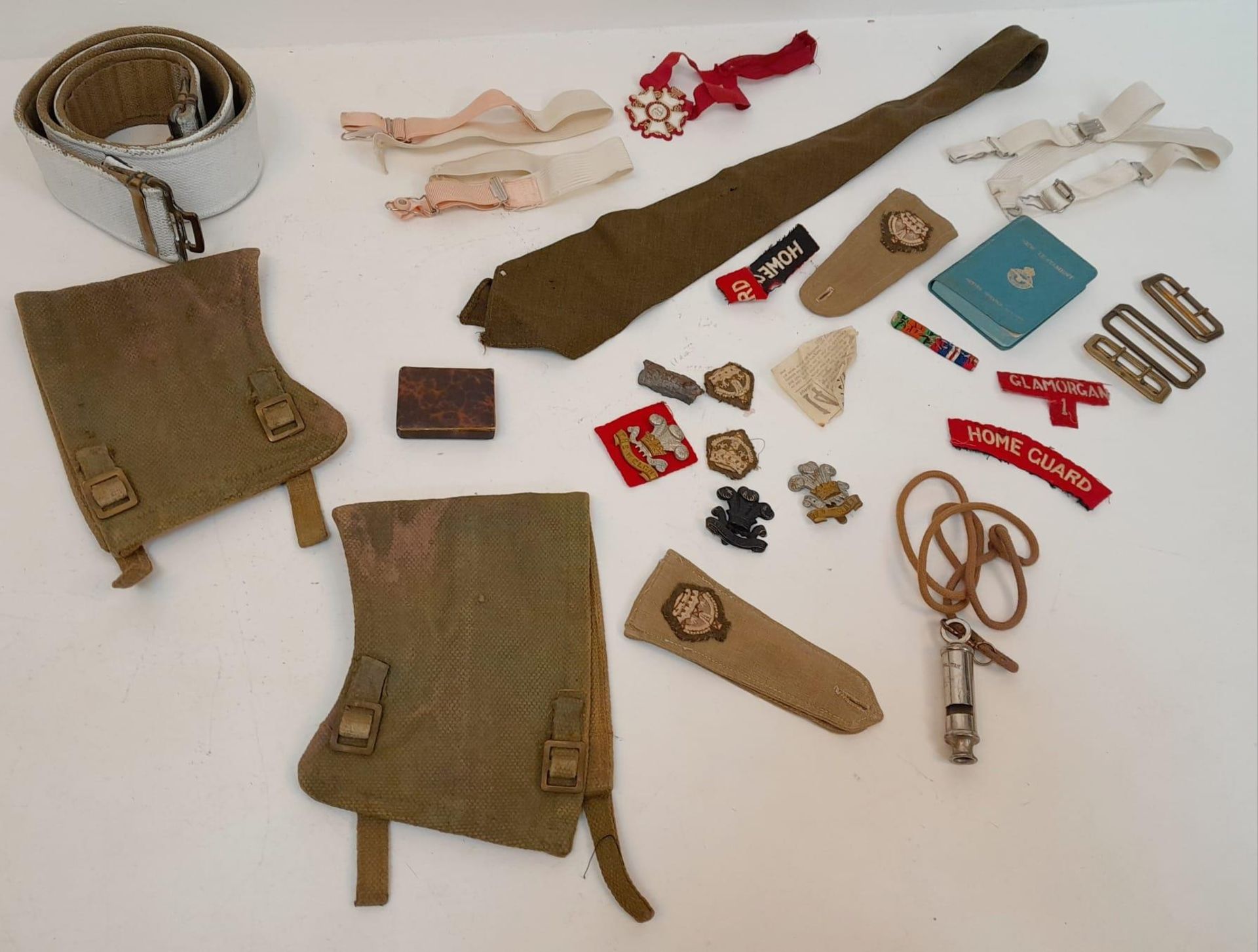 An Assortment of Vintage British Military Belts, Buckles and Badges.