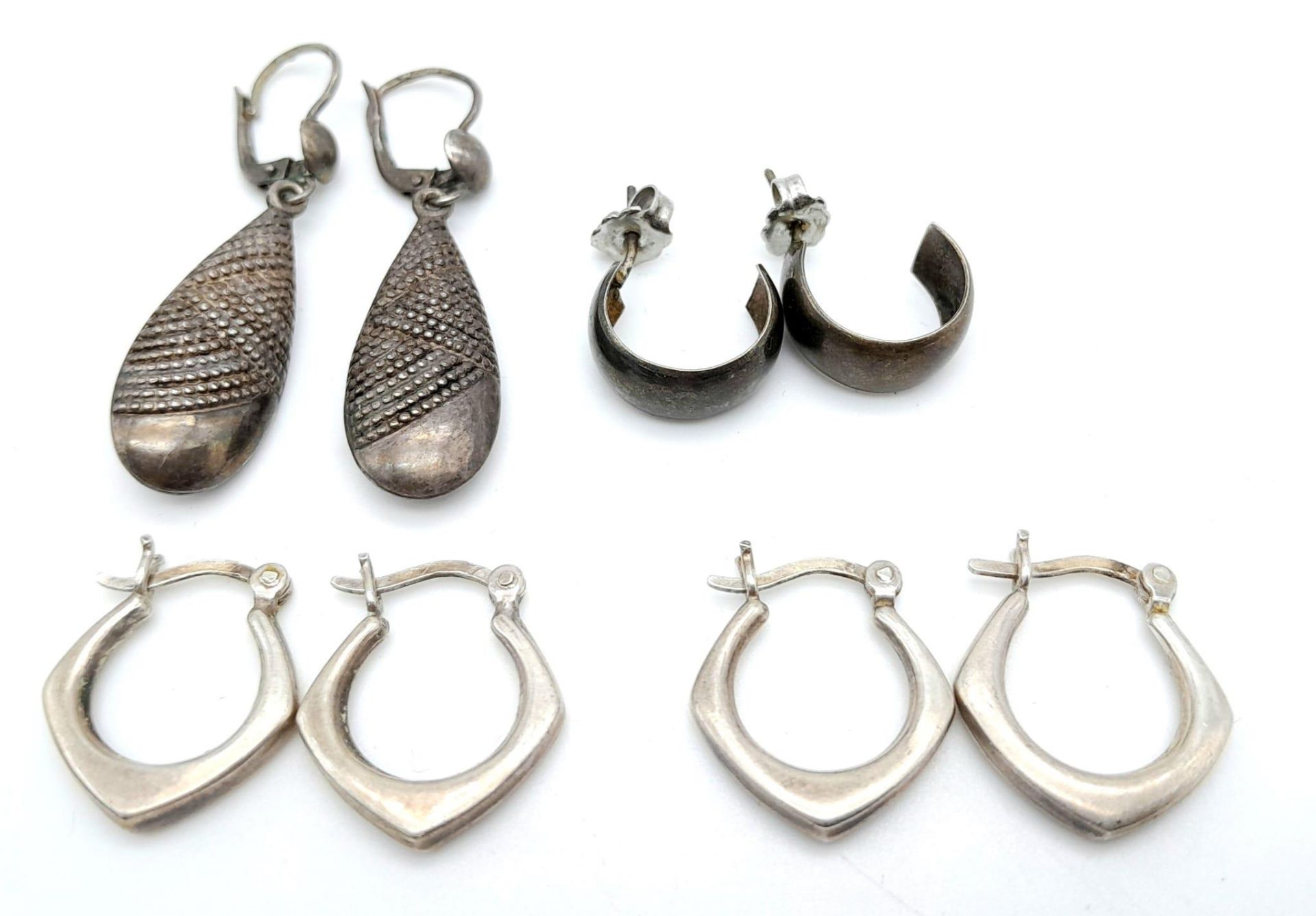 A collection of 4 vintage stylish pairs of silver earrings with various designs. Total weight 10.2G.