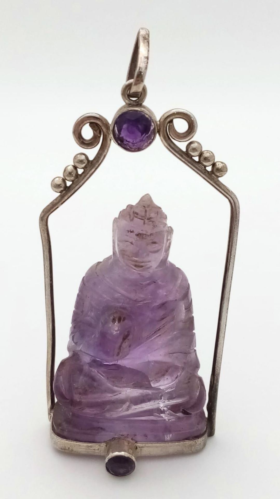 A Unique Vintage Amethyst Silver Mounted Buddha/Deity Pendant. The Carved Buddha measures 4.5cm Long