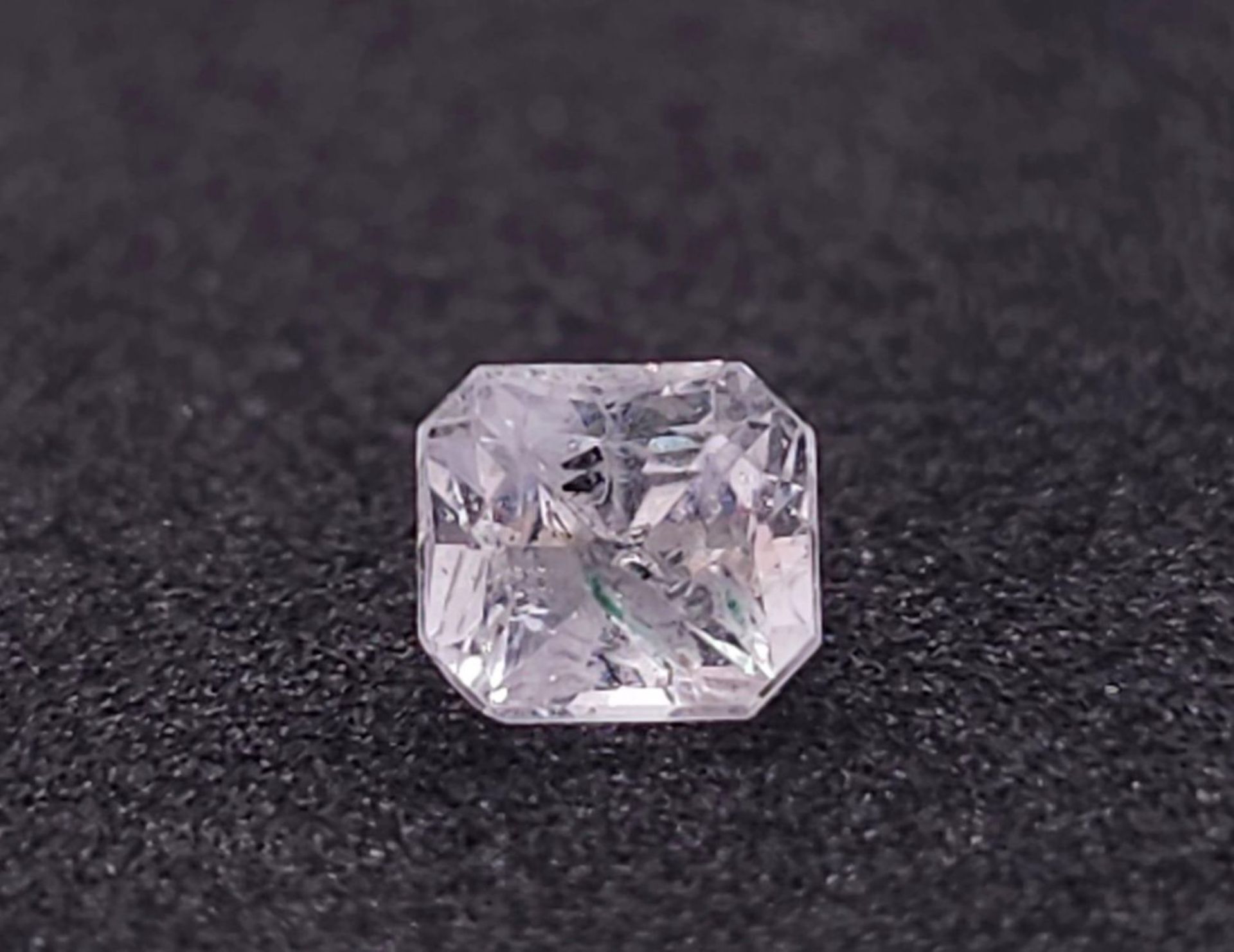 A 0.76ct Madagascar Colourless Natural Sapphire, in the Octagon Cut. Comes with the AIG Certificate. - Image 2 of 6