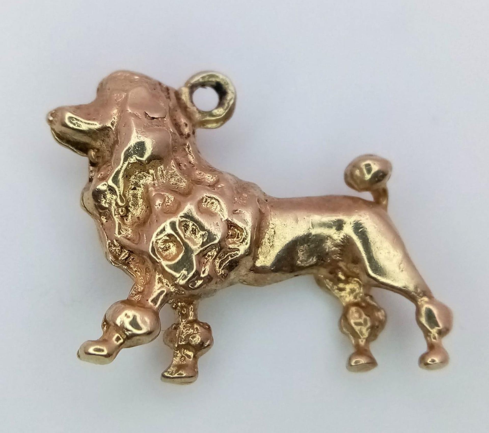 A 9K Yellow Gold French Poodle Pendant/Charm. 2cm. 3.5g weight.