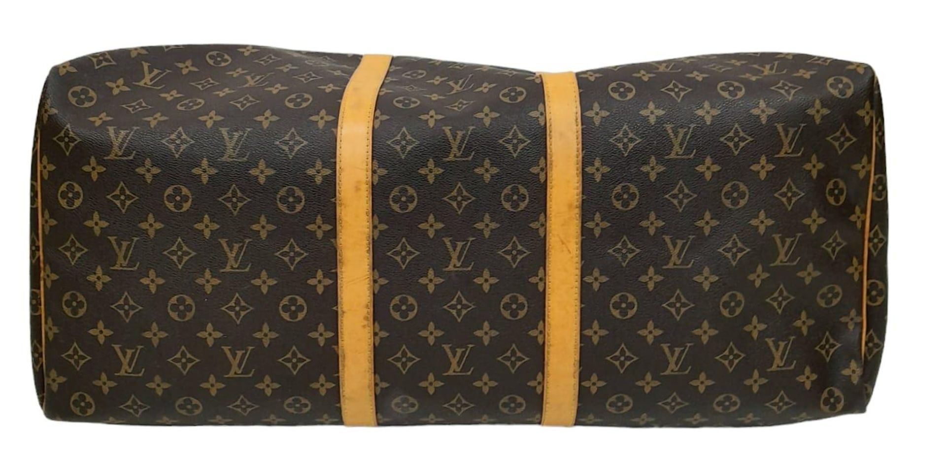 A Louis Vuitton Monogram Keepall 60 Travel Bag. Leather exterior with gold-toned hardware, two - Image 5 of 12