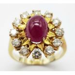 An 18K Gold (tested) Ruby and Diamond Ring. A 1.5ct high-grade ruby cabochon with a brilliant cut 12