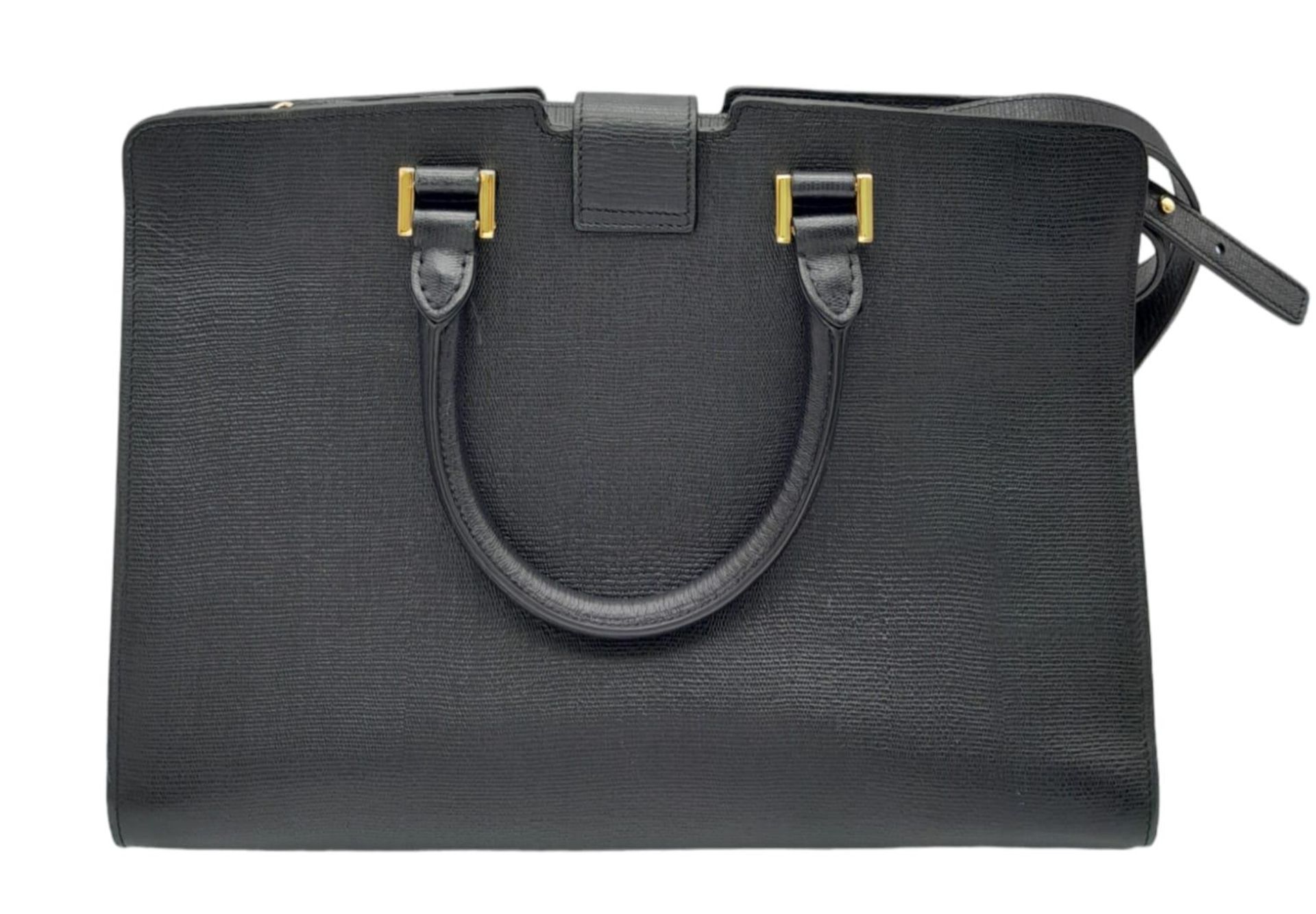 An Yves Saint Laurent Black 'Cabas' Handbag. Leather exterior with gold-toned hardware, two rolled - Bild 4 aus 8