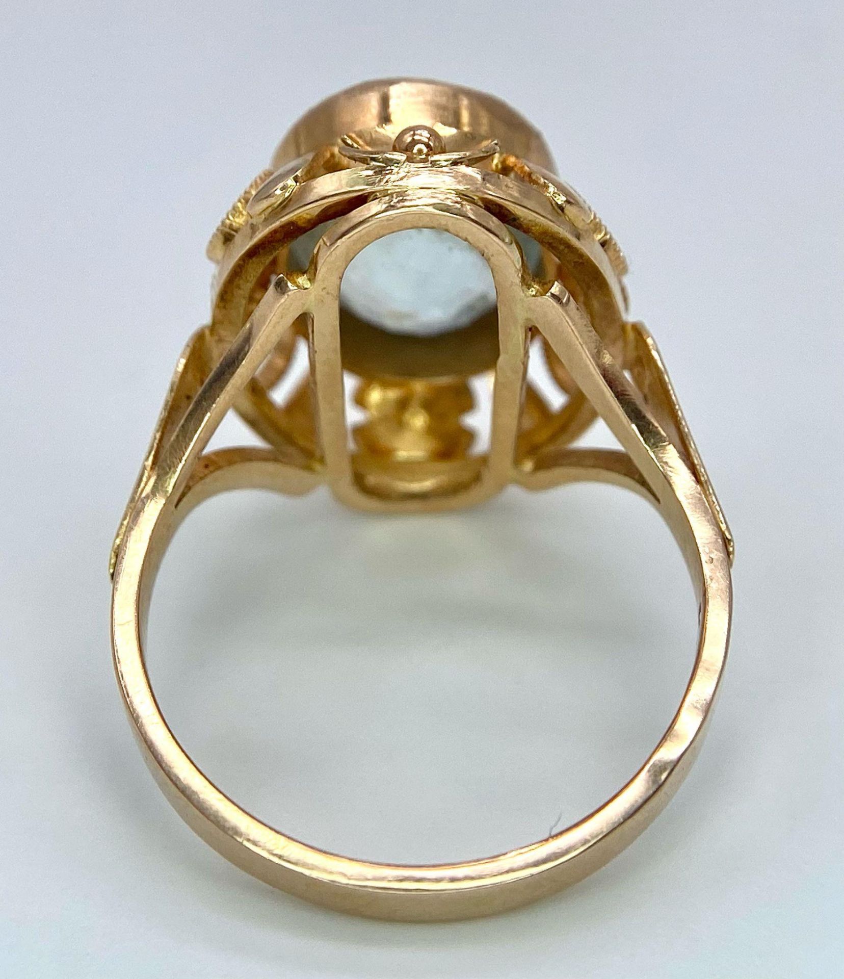 An 18K Rose Gold Aquamarine Ring. 6ct central aquamarine gemstone on a raised scroll foundation. - Image 6 of 7