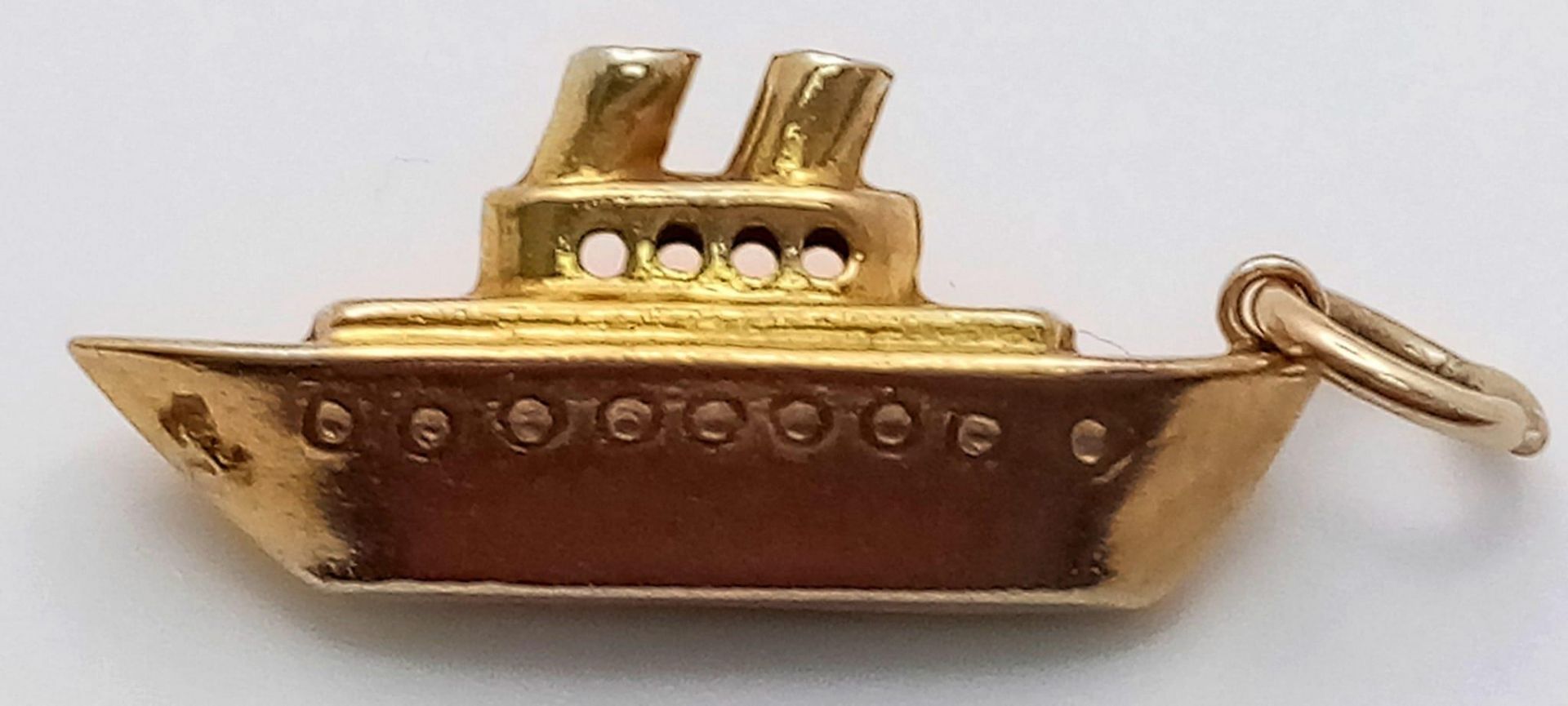 A 9K Yellow Gold Battleship Charm/Pendant. 3cm. 1g weight.