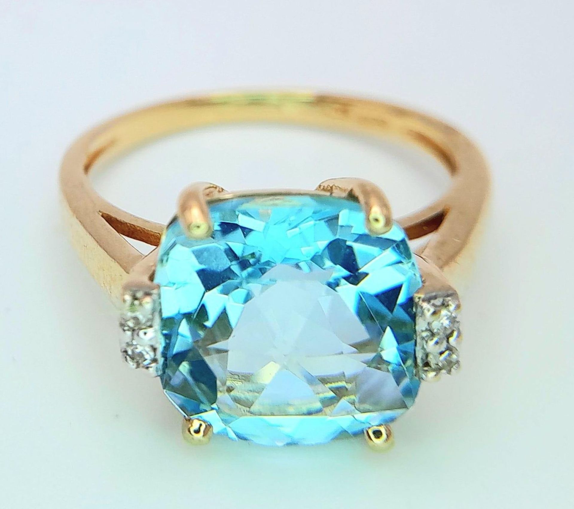 A very attractive 14 K yellow gold ring with a large, cushion cut aquamarine and a pair of - Image 3 of 14