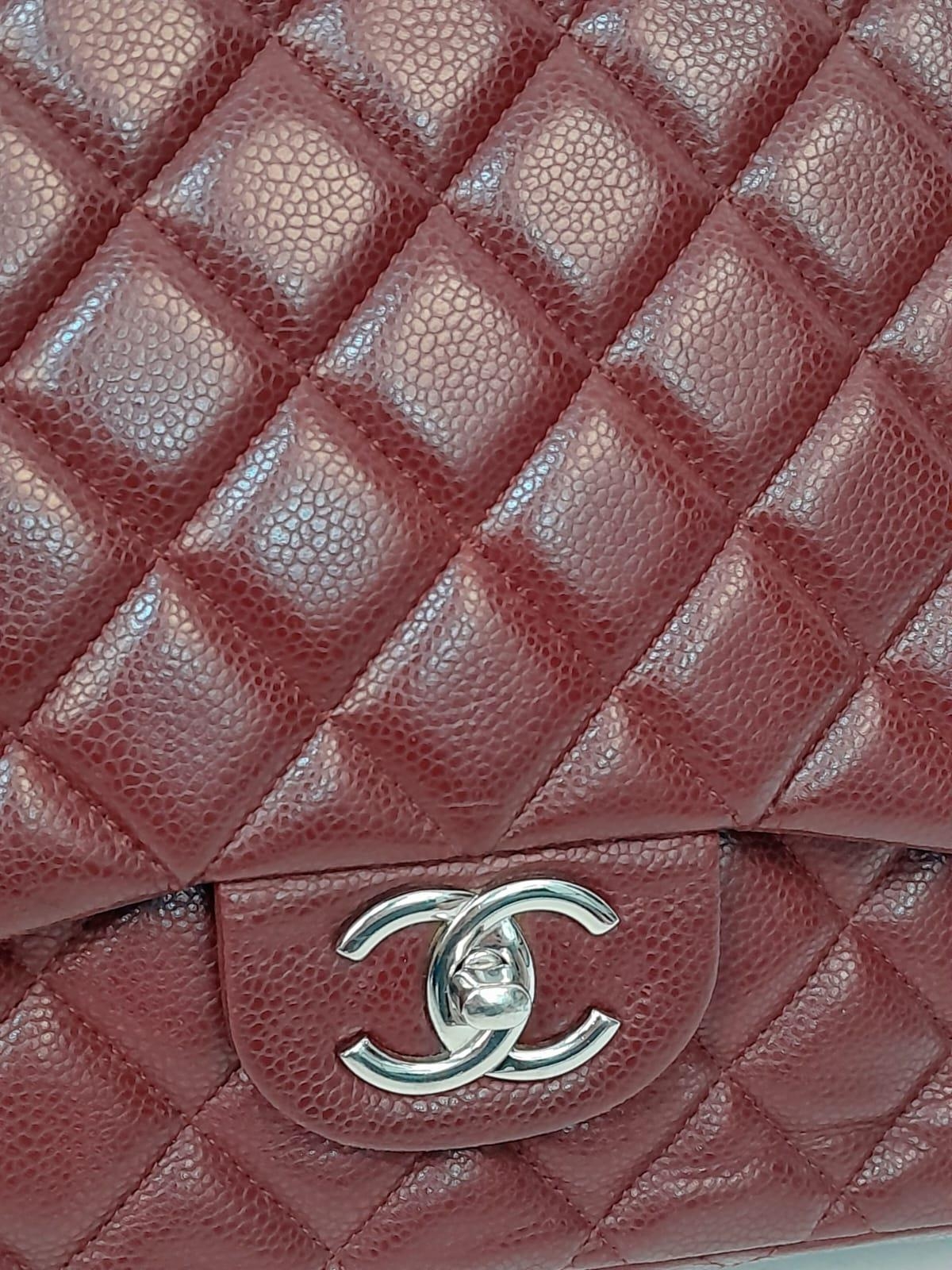 A Chanel Burgundy Jumbo Classic Double Flap Bag. Quilted leather exterior with silver-toned - Image 12 of 16