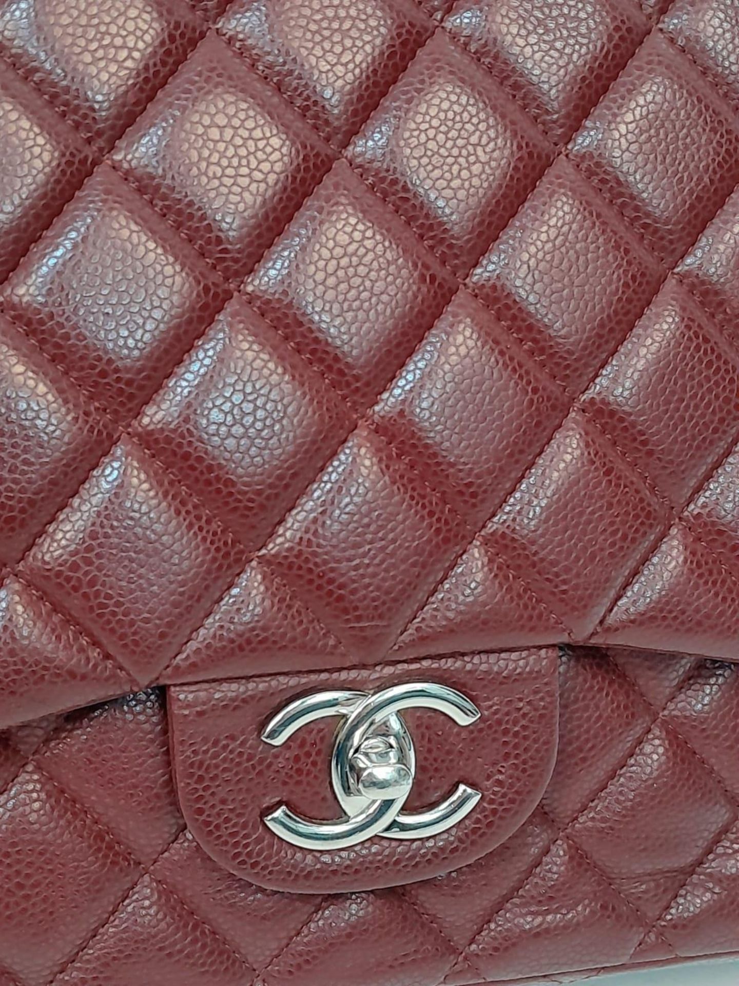 A Chanel Burgundy Jumbo Classic Double Flap Bag. Quilted leather exterior with silver-toned - Bild 12 aus 16