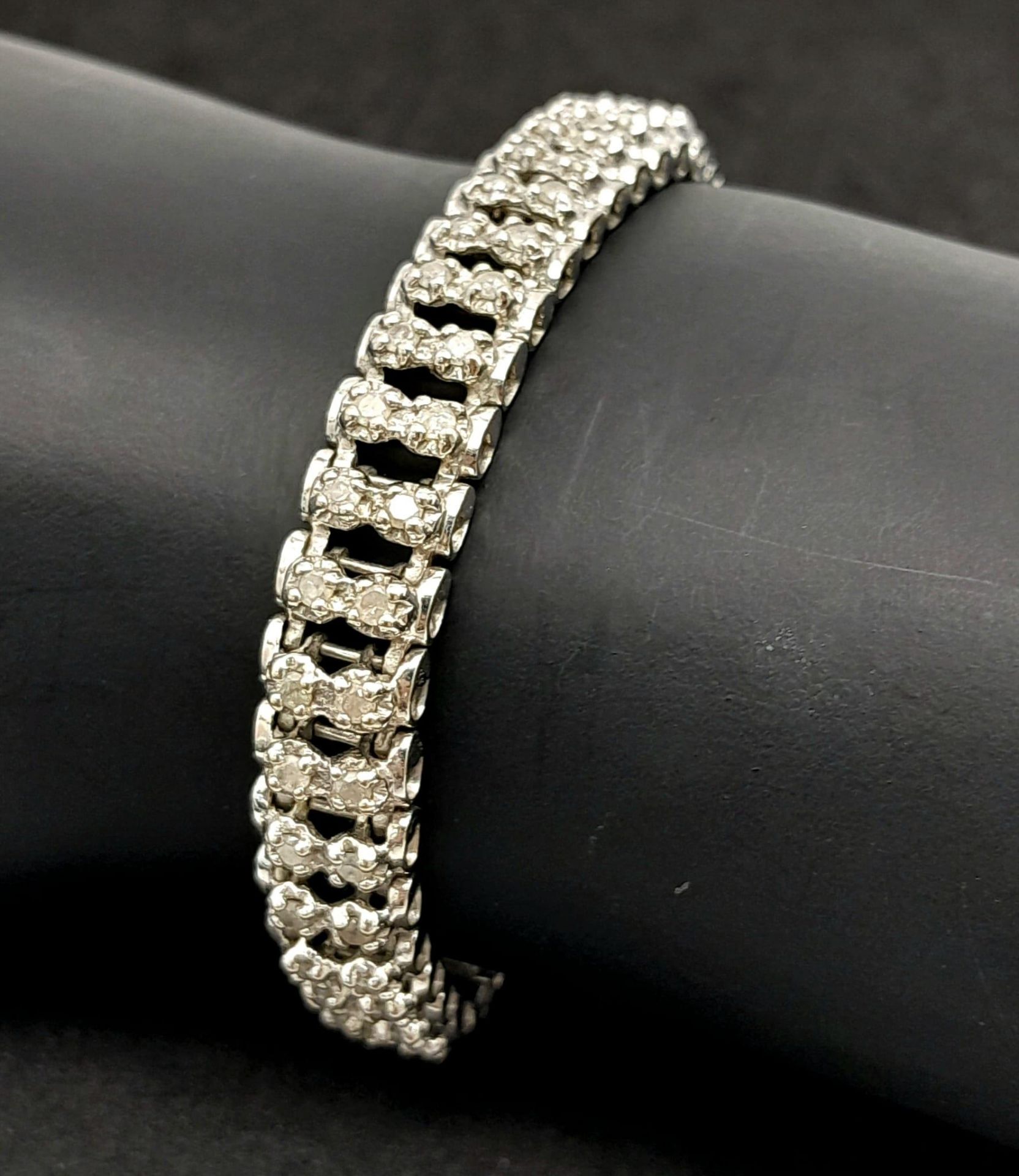 A 9K White Gold Diamond Tennis Bracelet. Two rows of 88 (total) diamonds! 18cm length. 15.3g total