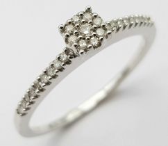 9K White Gold Diamond Cluster Ring (missing an end stone on one shoulder), approx 0.15ct diamond