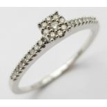 9K White Gold Diamond Cluster Ring (missing an end stone on one shoulder), approx 0.15ct diamond