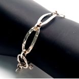 A 2013 London Hallmarked Sterling Silver Oval Link T. Bar Bracelet, 20cm Length. 9.07 Grams.