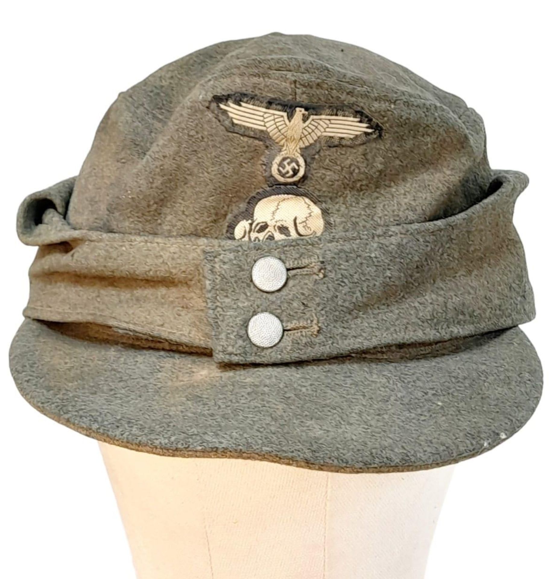 3rd Reich Waffen SS M43 Cap. very small cut on the top. A real “Been There” item.