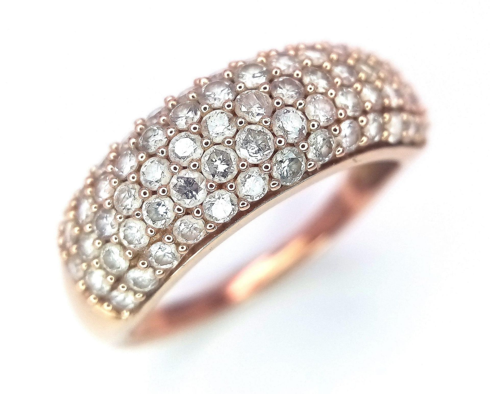 A 9K Rose Gold Diamond Encrusted Ring. Five rows of 70 small cut round diamonds. Size N. 3.2g