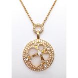 A Swarovski Gilded Necklace and Pendant with White Stone Decoration.