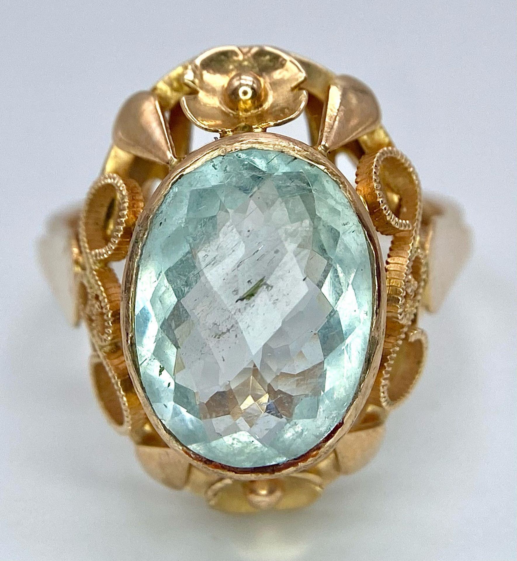 An 18K Rose Gold Aquamarine Ring. 6ct central aquamarine gemstone on a raised scroll foundation. - Image 5 of 7