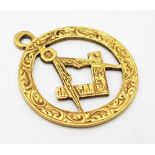 A Vintage 18K Yellow Gold Masonic Pendant. 2.5cm. 1.62g weight.