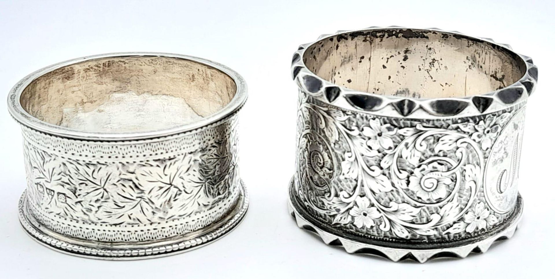 A collection of 2 antique sterling silver napkin holders with fabulous floral engravings. Come - Image 3 of 6