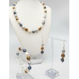 A natural, multi-coloured pearl necklace, bracelet and earrings set, in a presentation box. Necklace