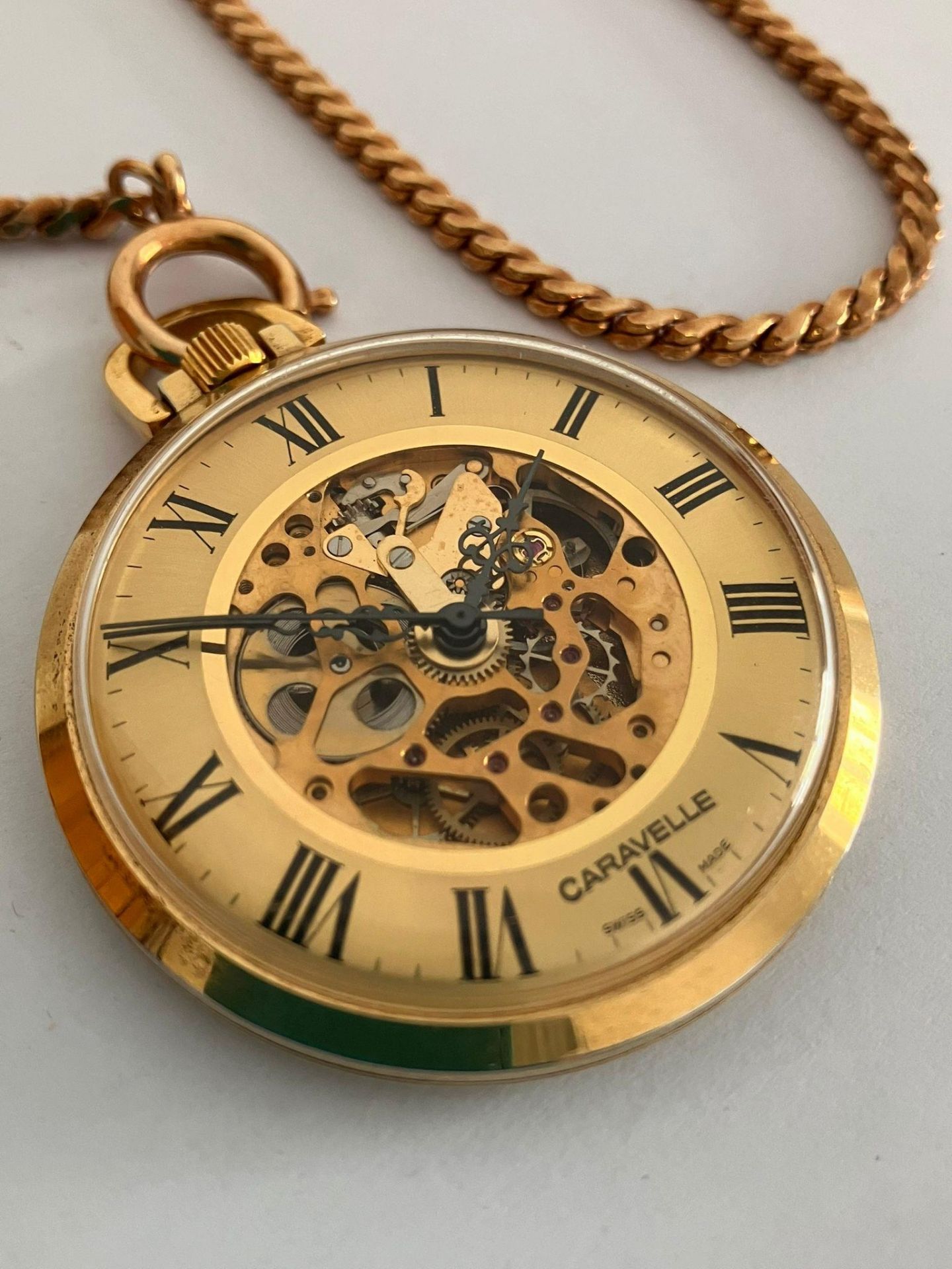 BULOVA CARAVELLE SKELETON POCKET WATCH. Finished in gold tone and complete with gold plated chain. - Bild 2 aus 4