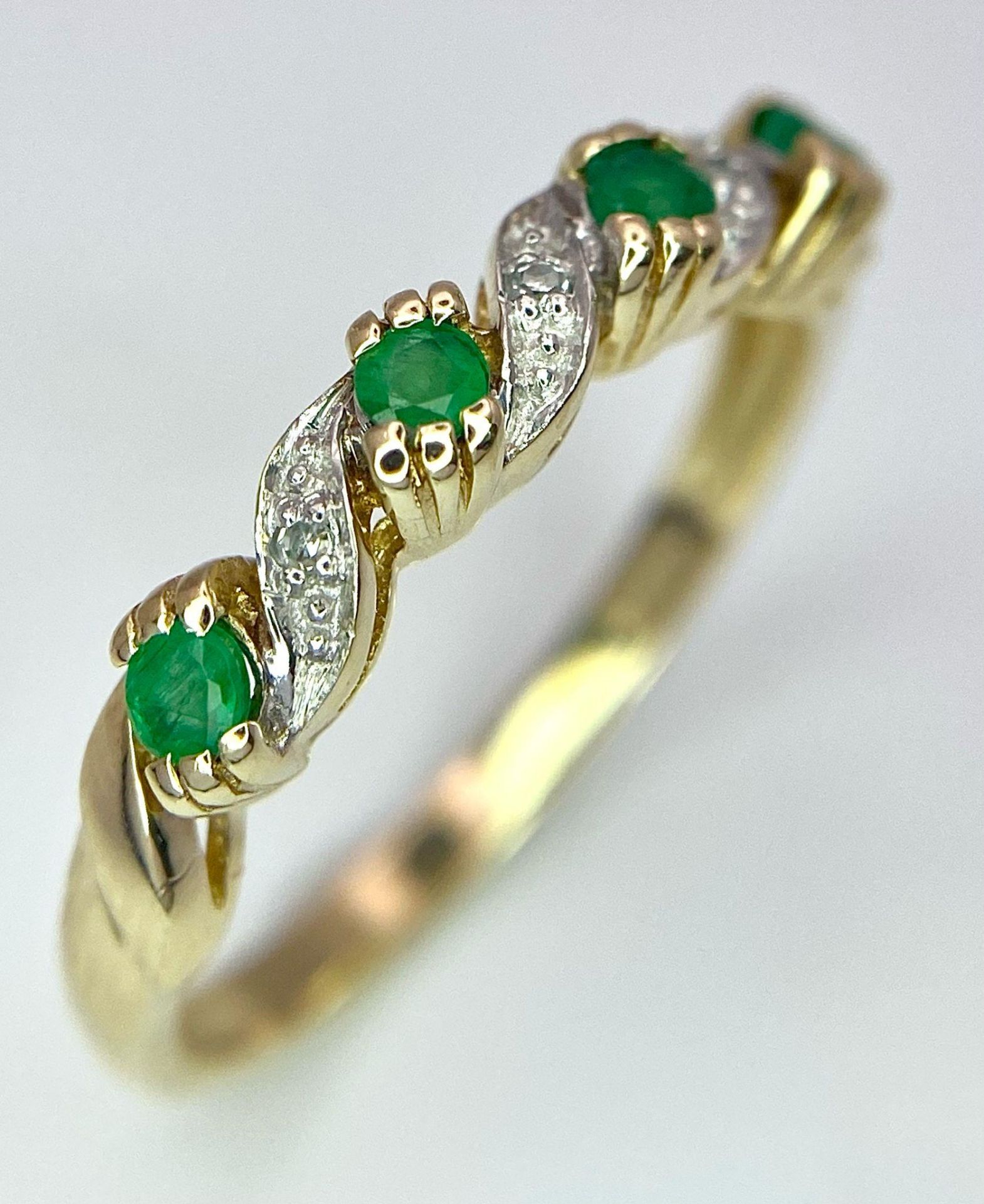 A 9K Yellow Gold Diamond and Emerald Ring. Size P, 2g total weight. Ref: 8446