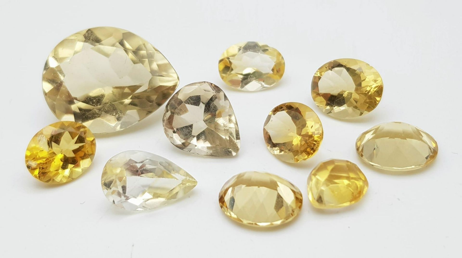 A Parcel of 10 Citrines. Assorted Sizes up to 2.3cm, Assorted Cuts. 55.96 Carats Total.