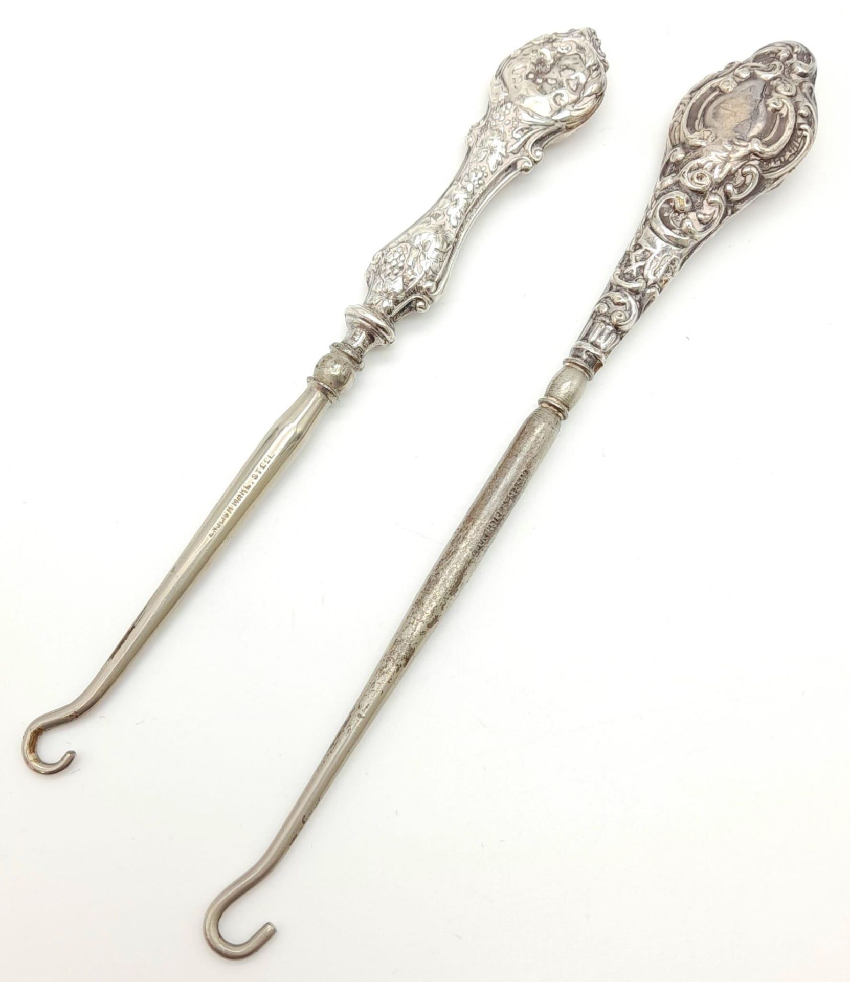 Two Antique Ornate White Metal Boot Hooks - 17 and 15cm.