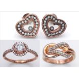 A sterling silver group of TWO rings and ONE pair of earrings, with rose gold vermeil finish and