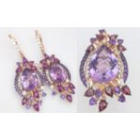 A stunning LE VIAN design, 14 K rose gold ring and earrings set with large pear shaped amethysts and