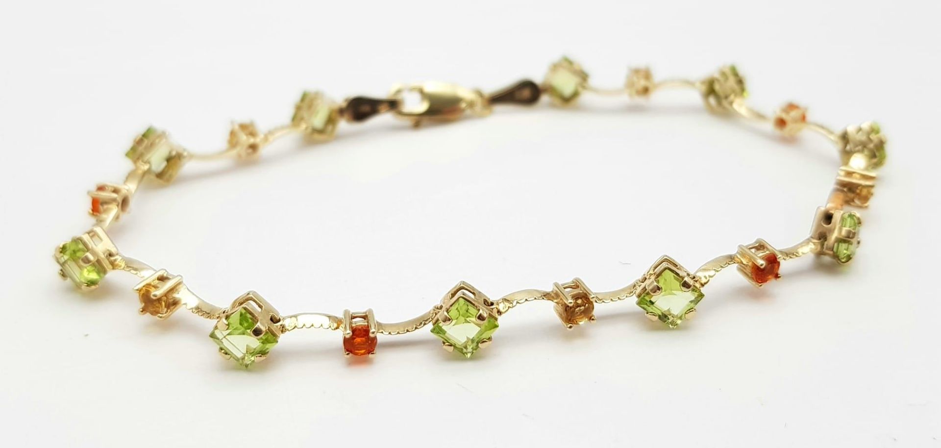 A 14K Yellow Gold Multi Coloured Gemstone Set Bracelet. 18.5cm length, 4.2g total weight. Ref: SC - Image 2 of 6