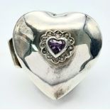 A Vintage Sterling Silver Heart Shaped Pill Box with Amethyst Decoration. Hallmarks at rear. 3.5 x