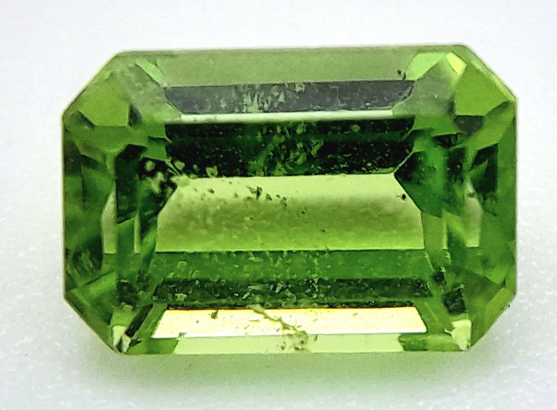 A 1.26ct Pakistan Natural Peridot, with the Octagon shape and Step & Step Cut. Comes with GFCO Swiss
