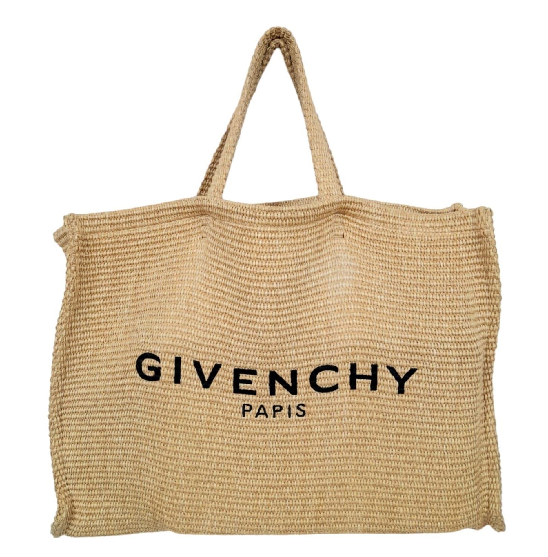 A Givenchy Raffia Tote Bag. Woven textile exterior with two straps. Woven textile interior with an
