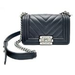 A Chanel Black Leather Boy Bag. Chevron decorative soft black leather with an antique style/finish