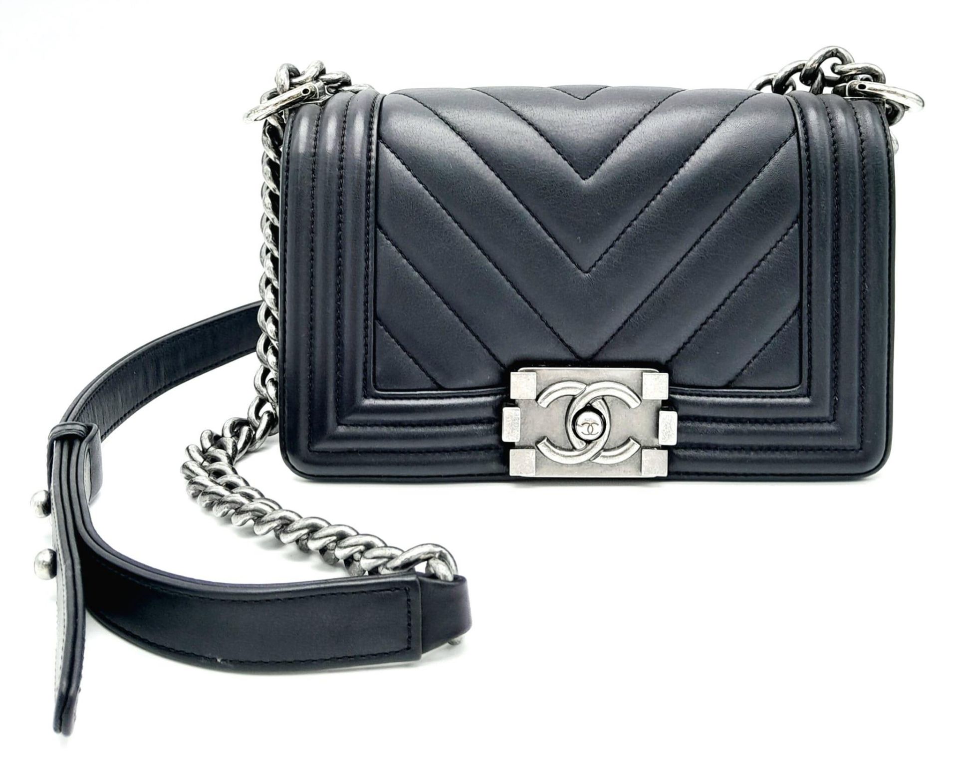 A Chanel Black Leather Boy Bag. Chevron decorative soft black leather with an antique style/finish