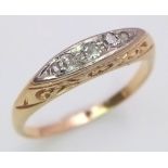 An antique yellow gold (tests 18 K) ring with a band of five old cut diamonds resting on a hand-