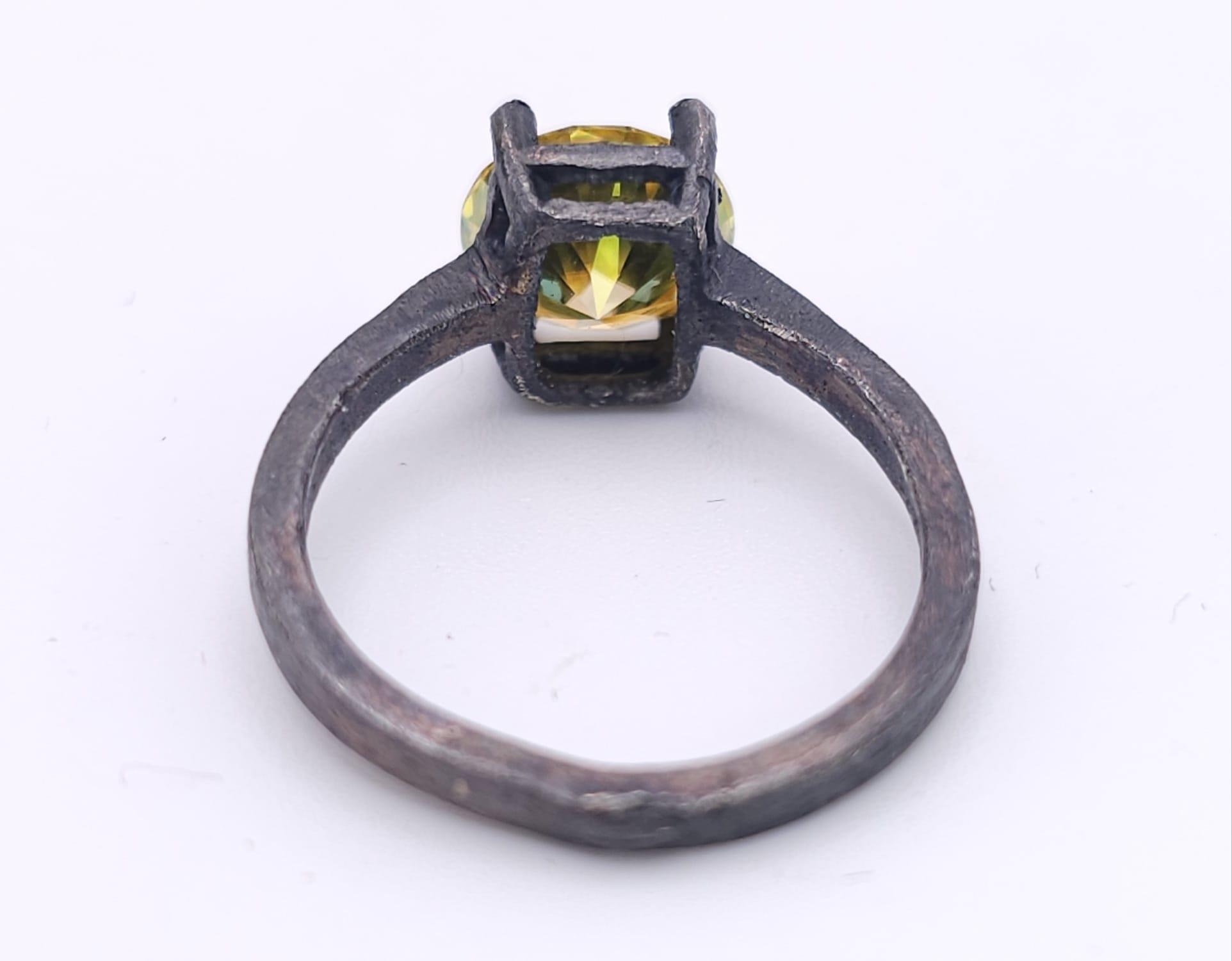 A sterling silver, with a black patina, solitaire ring with a round cut, yellow moissanite (2 - Image 3 of 13