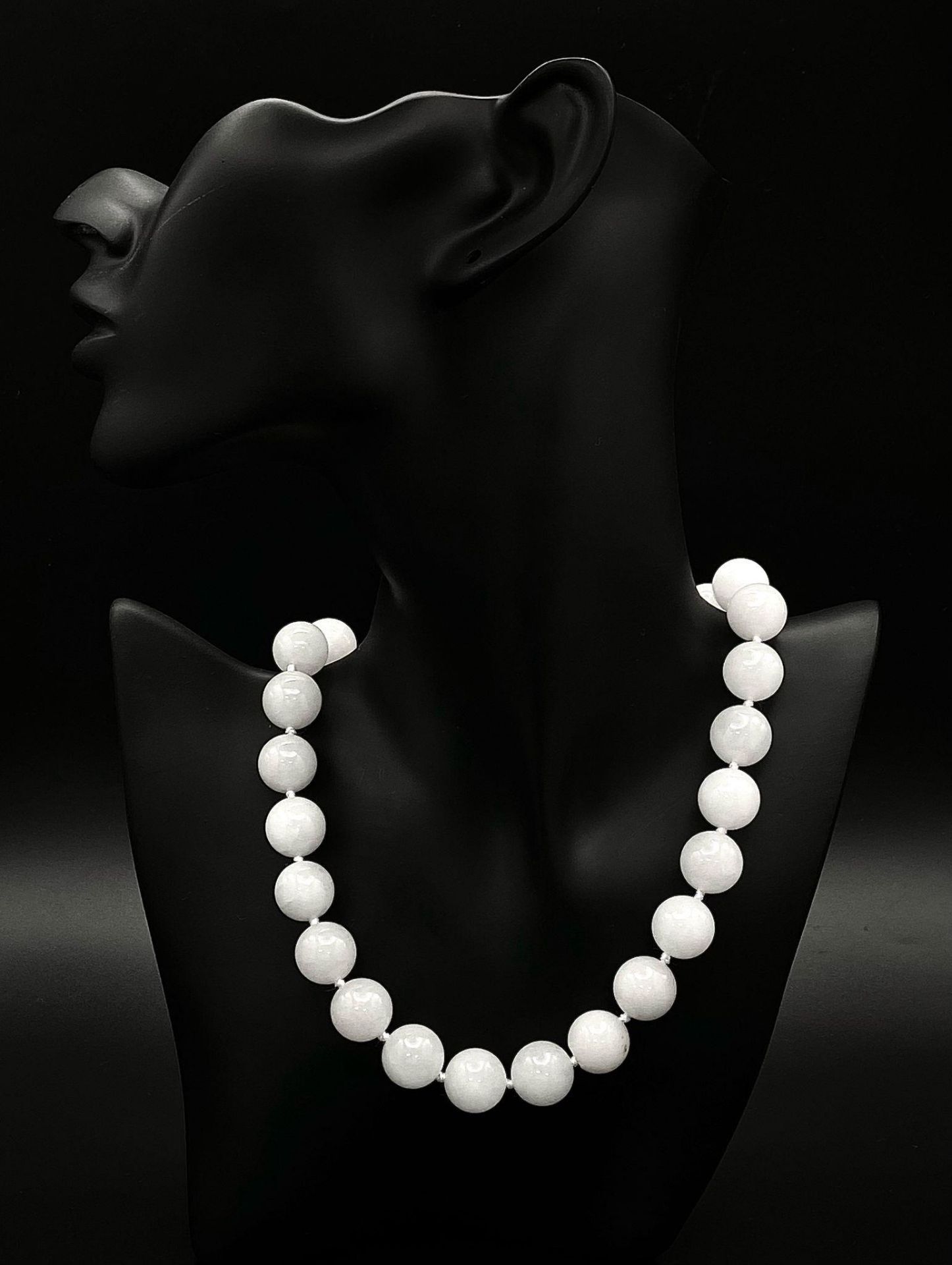A Bright White Jade Bead Necklace. Good sized beads - 14mm. 42cm necklace length. Lifesaver clasp.