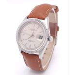 A Rolex Oyster Perpetual Date Automatic Gents Watch. Brown leather strap. Stainless steel case -