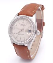 A Rolex Oyster Perpetual Date Automatic Gents Watch. Brown leather strap. Stainless steel case -