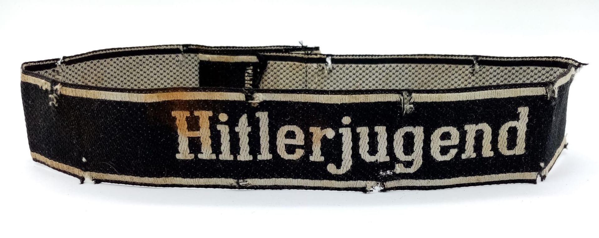 3rd Reich 12th SS Panzer “Hitler Youth” Cuff Title. Marked “Bevo Wuppental” Passes the black light
