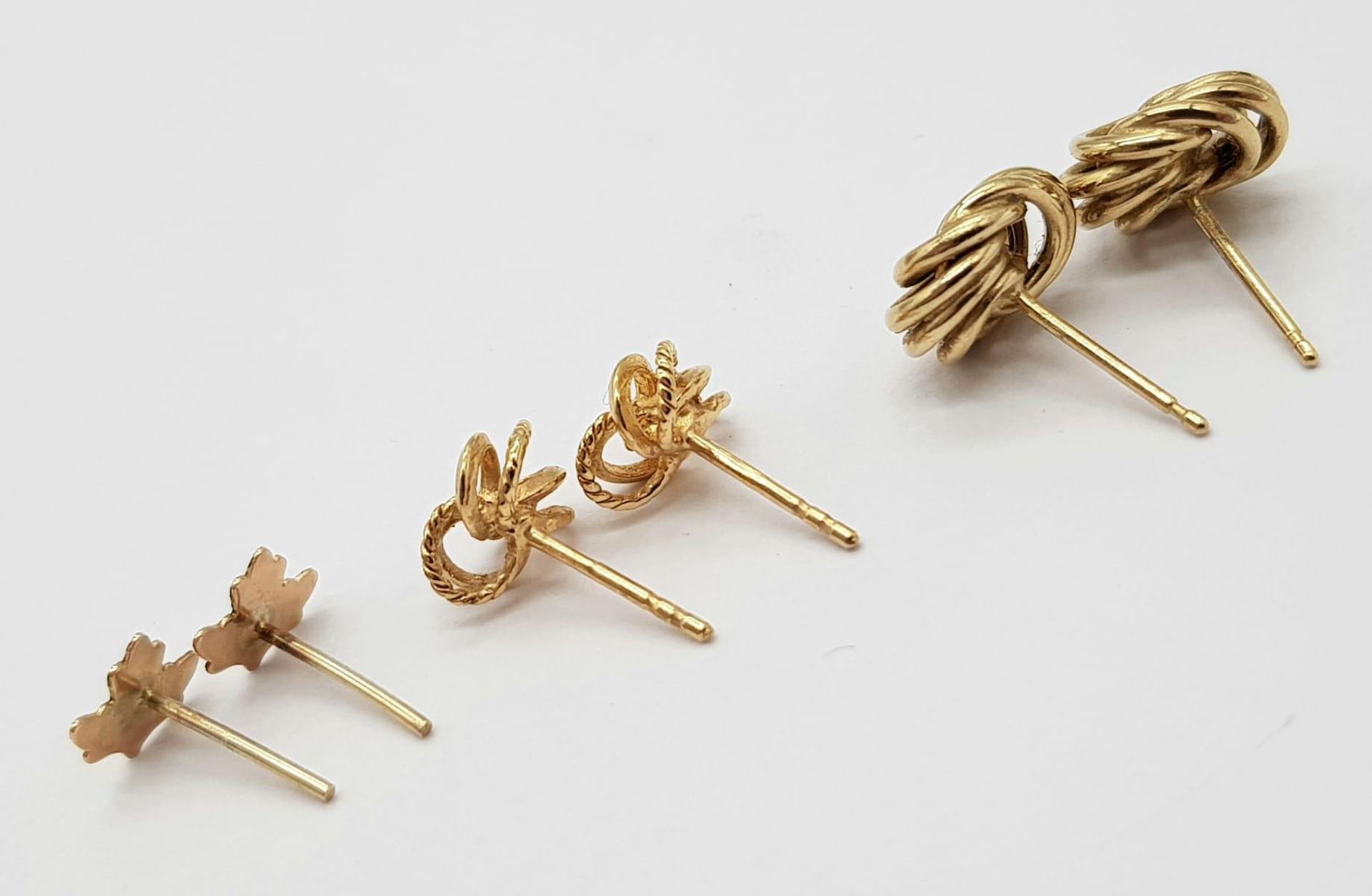 Three Pairs of 9K Yellow Gold Different Style Earrings - Knot, leaf and entwined. No backs. 1.9g - Image 5 of 5