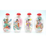 A group of four Peking glass snuff bottles with exquisite miniature paintings on the inside of the