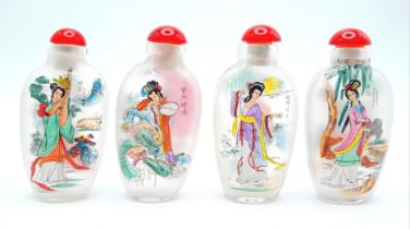 A group of four Peking glass snuff bottles with exquisite miniature paintings on the inside of the