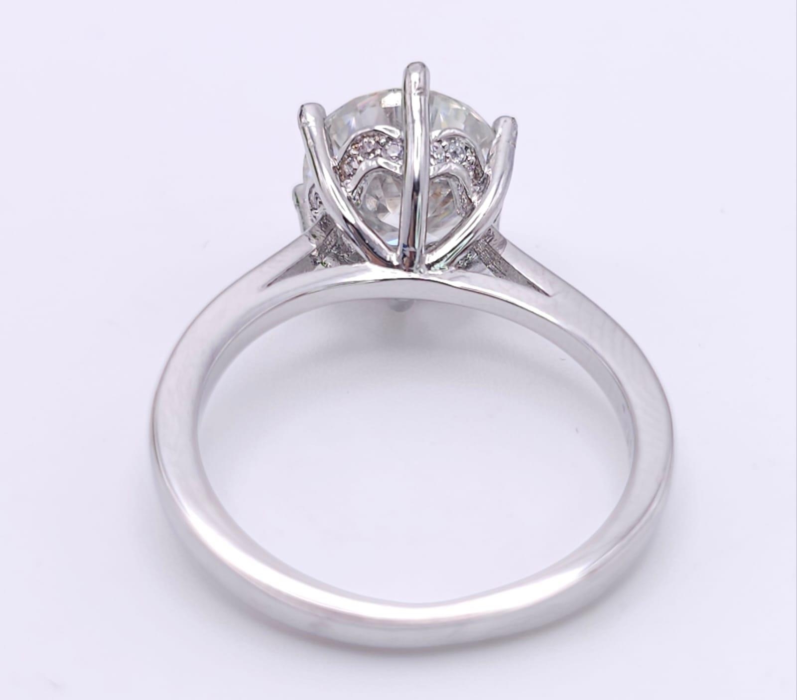 A sterling silver solitaire ring with a stunning round cut moissanite (3 carats), size: N, weight: - Image 6 of 13