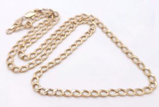 A 9K Yellow Gold Flat Curb Link Chain. 53cm length. 5.5g weight.
