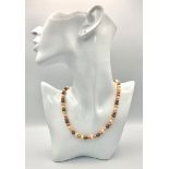 A multi coloured faux pearl necklace with a silver clasp. length; 42 cm, weight: 21.2 g.