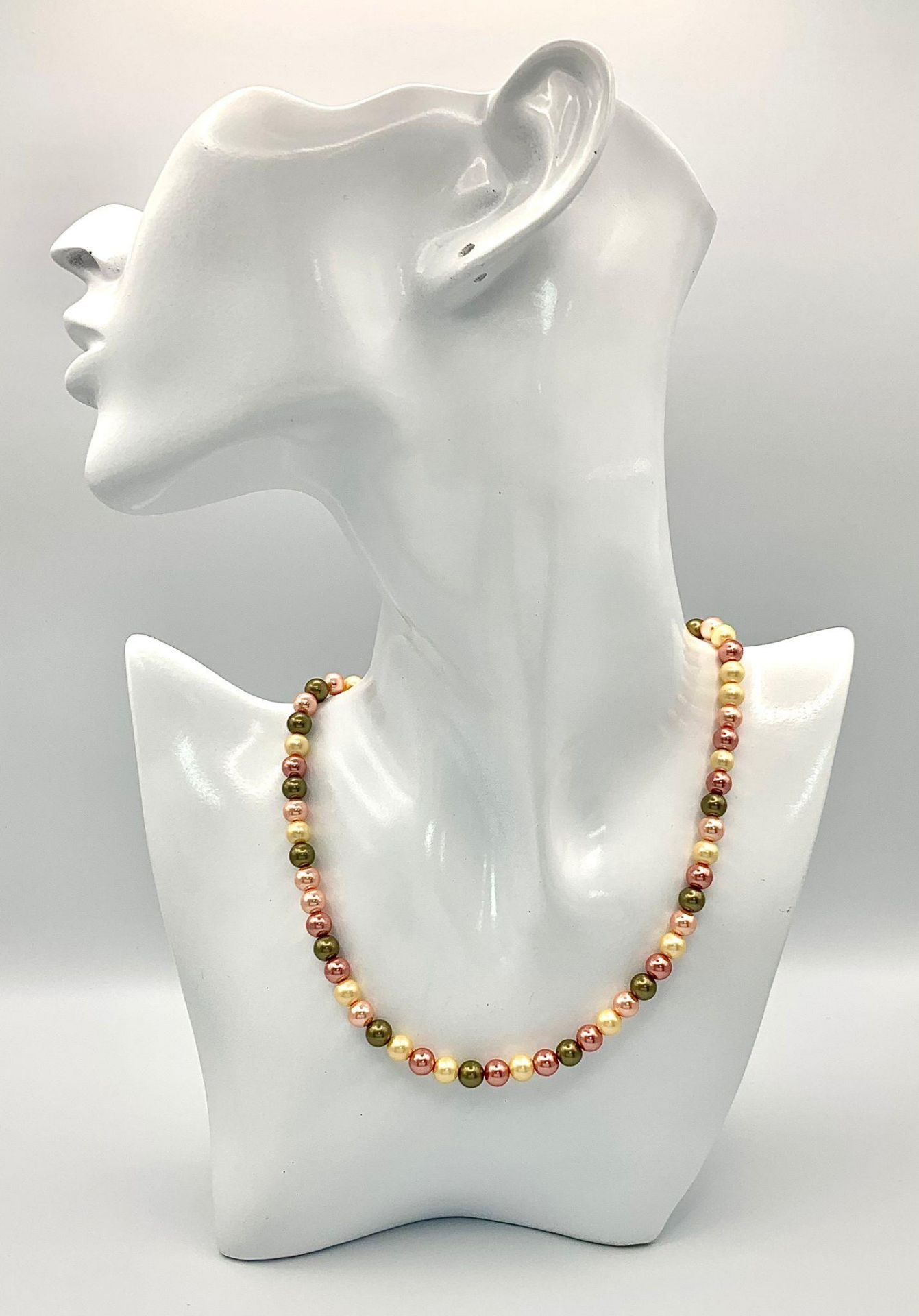 A multi coloured faux pearl necklace with a silver clasp. length; 42 cm, weight: 21.2 g.