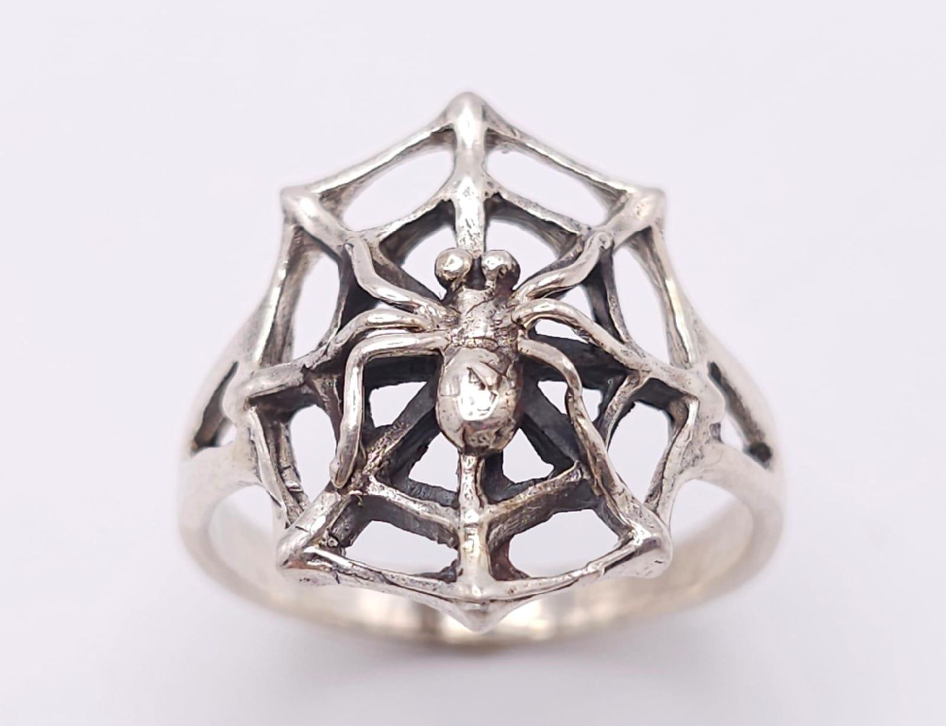 A Unique Vintage Sterling Silver Spider and Spider Web Ring Size Q. The Crown Measures 2cm Long